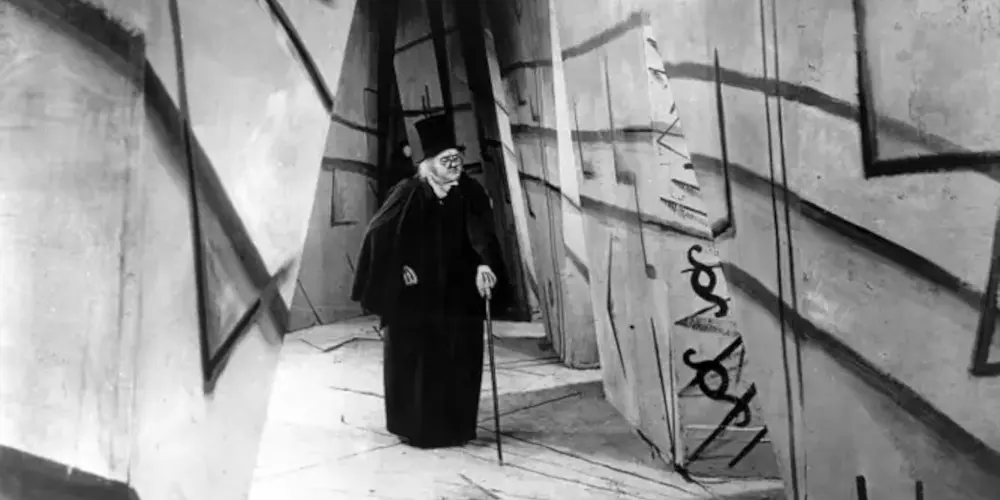 Still from The Cabinet of Dr Caligari (Robert Wiene, 1920). Werner Krauss in the title role walks towards the camera